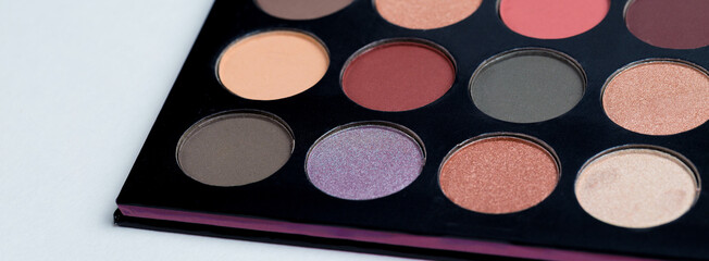 Colorful eye shadows palette. Colorful make-up palette background.