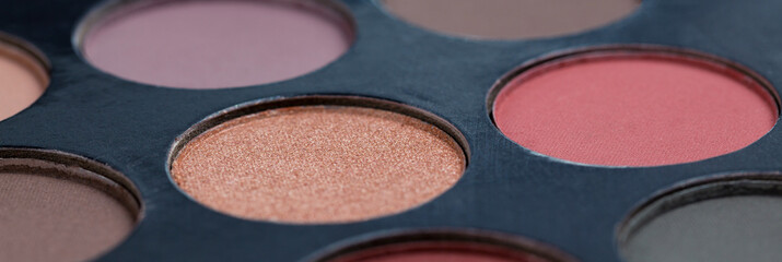 Colorful eye shadows palette. Colorful make-up palette background.