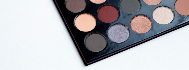 Colorful eye shadows palette. Colorful make-up palette background.