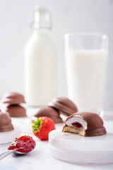 Tea cakes of soft melting marshmallow centre, strawberry jam filling and chocolate coated