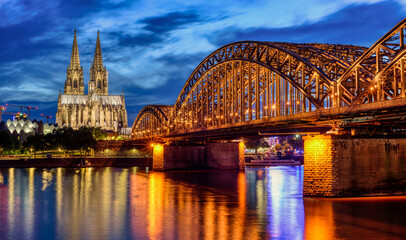 Hohenzollern Bridge and gothic Cathedral in Cologne city, Germany