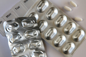 Healthcare pills and a pill box.