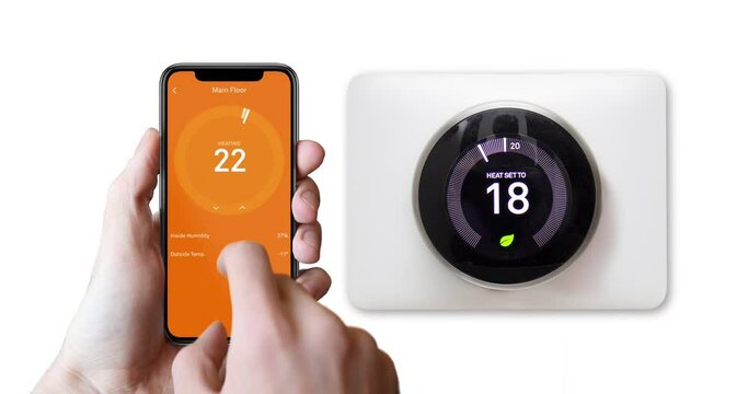 A person warming up the thermostat temperature with a smart phone.