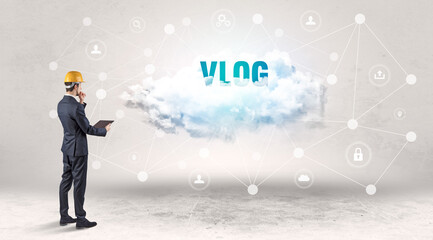 Engineer working on a social media concept with VLOG inscription