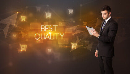 Businessman with shopping cart icons and BEST QUALITY inscription, online shopping concept