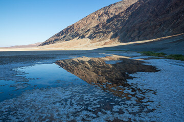 Fototapeta premium The salt bed of Badwater Basin, the lowest point in North America at -282 feet, in Death Valley National Park in California.