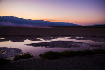 Beautiful sunset at Badwater Basin, the lowest point in North America, in Death Valley National Park (California).