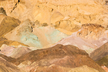 Stunning landscape view of the colorful rock formations of Artist's Pallete during susnet in Death Valley National Park (California).