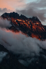 Naklejka premium fire in the mountain and clouds