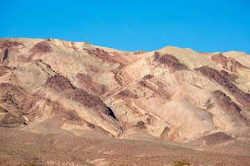 Stunning landscape view of the colorful rock formations of Artist's Pallete during susnet in Death Valley National Park (California).