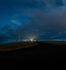 Llighthouse Storhofdi Vestmannaeyjar, the Moon is behind the Lighthouse.