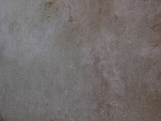 Grey textured wall.