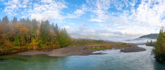 Fall Color and Fog Along a River in the Pacific Northwest. Yellows, reds, and verdant greens with ground fog are predominant at this time of year along the Nooksack River, Washington state.