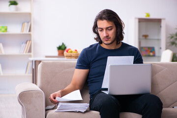 Young man employee working from house