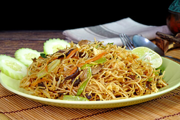 Stir fried rice noodle with mushroom, carrot and vegetable. Vegetarian food.