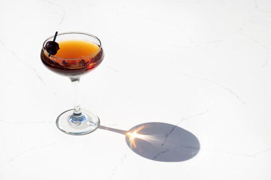 Classic Cocktail in a coupe glass with reflection