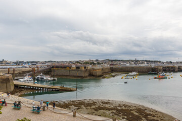 Fototapeta na wymiar Summer coastline landscape of Saint Malo in a cloudy day, Brittany, France