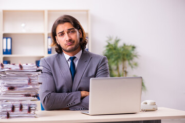 Fototapeta premium Young male employee and too many cockroaches in the office