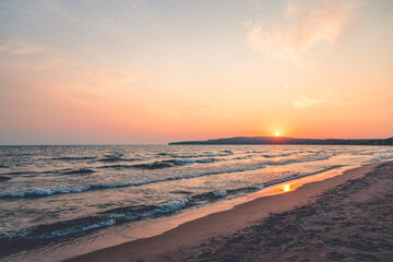 Sandy beach at sunset with clouds lake Superior Ontario Canada