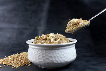 Lapsi,Halwa or Sheera i Indian Traditional and healthy sweet made from wheat or sorghum with milk nad desi ghee during festival seasons.