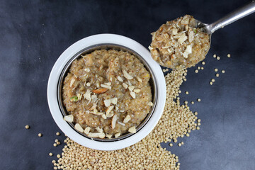 Lapsi,Halwa or Sheera i Indian Traditional and healthy sweet made from wheat or sorghum with milk nad desi ghee during festival seasons.