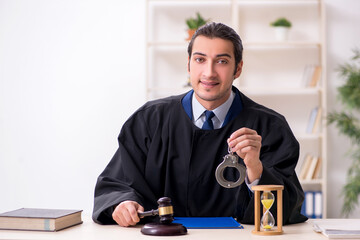 Young male judge in time management concept