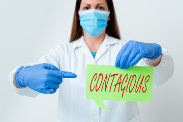 Text sign showing Contagious. Business photo text transmissible by direct or indirect contact with...