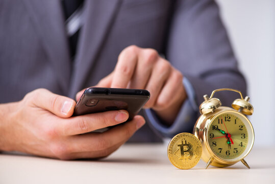 Young man earning money via Internet in time management concept