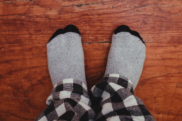 Feet in socks on the stairs.
