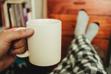 Drinking coffee in the morning in pajamas and socks