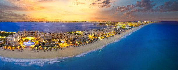 Cancun beach with orange sunset