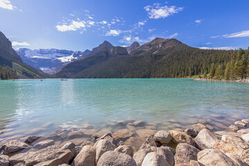 turquoise water surround with taiga forest and rocky mountain in summer morning at Lake Louise, Alberta Canada