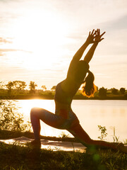 woman practicing yoga with nature in the morning, yoga outdoors, relax in nature	
