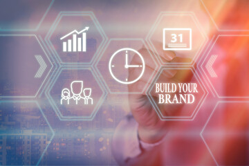 Conceptual hand writing showing Build Your Brand. Concept meaning enhancing brand equity using advertising campaigns Grids and different icons latest digital technology concept