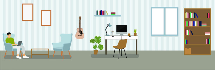 Freelancer room interior. Home office workplace. Young guy freelancer works for a laptop.