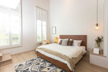 Master bedroom in rustic style with minimalist white double bed and hanging lamp. - Powered by Adobe