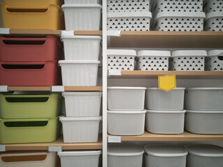 Many colorful of empty plastic cloth basket on shelf