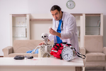 Young male paramedic visiting skeleton patient