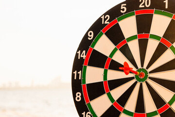 Closeup the dart arrow hit center on Bullseye(bull's-eye) of a dartboard is a target of challenge...