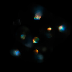 Abstract blurred color light spots. Lens, glass or crystals flare bokeh