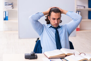 Young businessman student studying at workplace