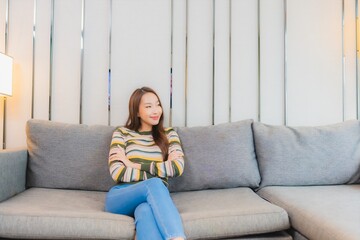 Obraz premium Portrait beautiful young asian woman smile relax on sofa