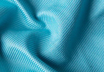 Naklejka na ściany i meble Blue fabric as an abstract background.