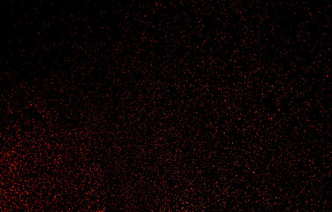 Red sparks of fire on a black background.
