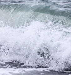 Wave in the sea with splashing water.