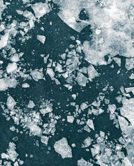 Broken ice on the ground as a background.