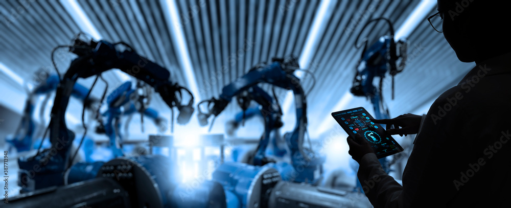 Poster Factory Female Industrial Engineer working with automation robot arms machine in intelligent factory industrial on real time monitoring system software.Digital future manufacture.