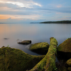Landscape captured at sunset with textured foreground and long exposure