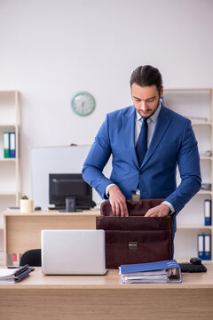 Young male businessman employee working in the office