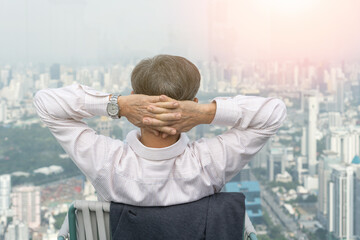 Happy old man in hospice residence. Relax easy senior retire lifestyle sitting at skyscraper in...